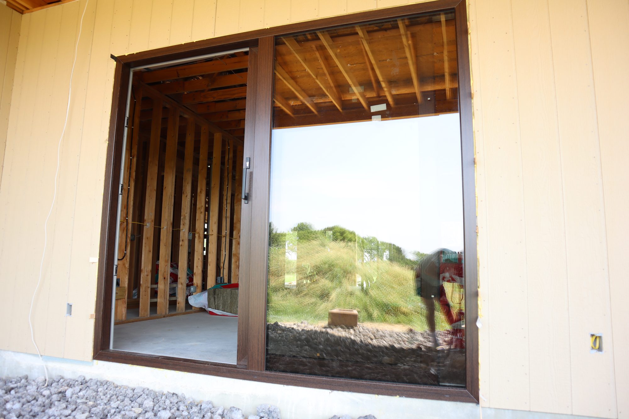 Installed sliding patio door, open, with a view to the backyard